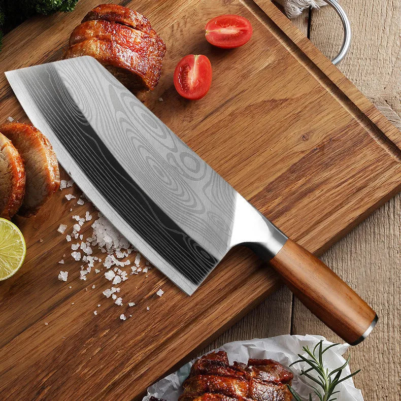 Stainless steel kitchen knife with a 320mm long blade on a kitchen counter.