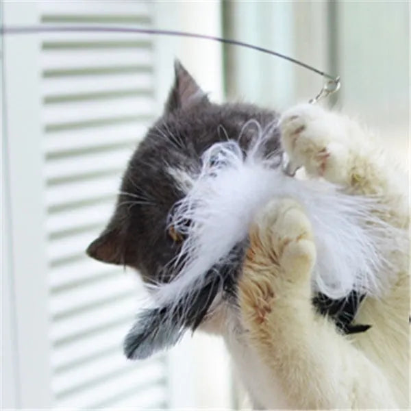 Funny cat stick with wooden handle, flexible rod, and black and white fur replacement head with feather and bell
