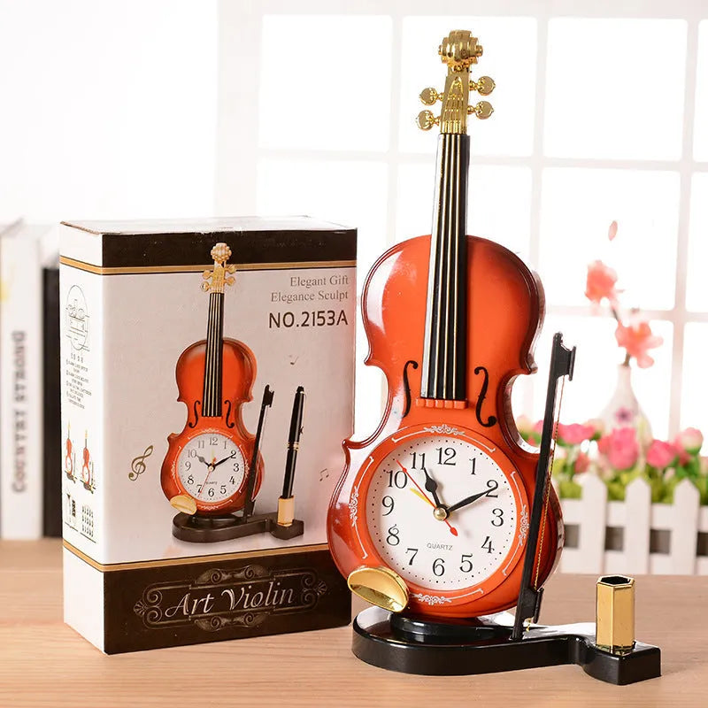 Brown violin pen inserted alarm clock with LED and pointer display, plastic body, 290 x 145 mm