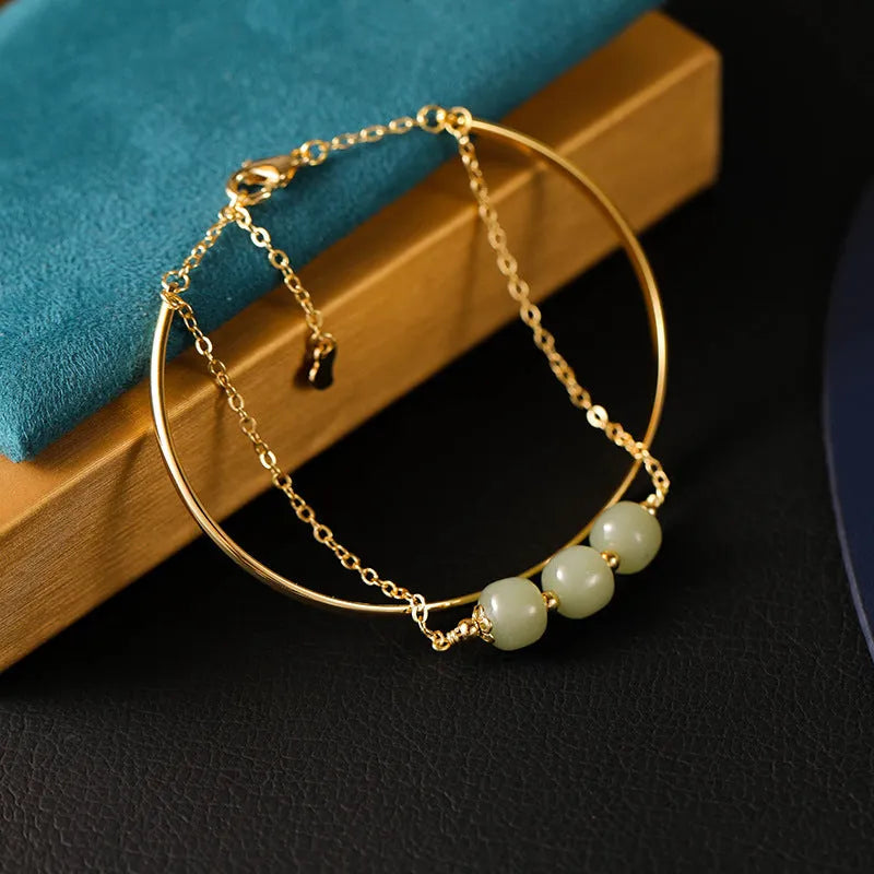 Women's Hetian jade lucky beads bracelet with gold inlay, shown in single, double, and three bead version styles.