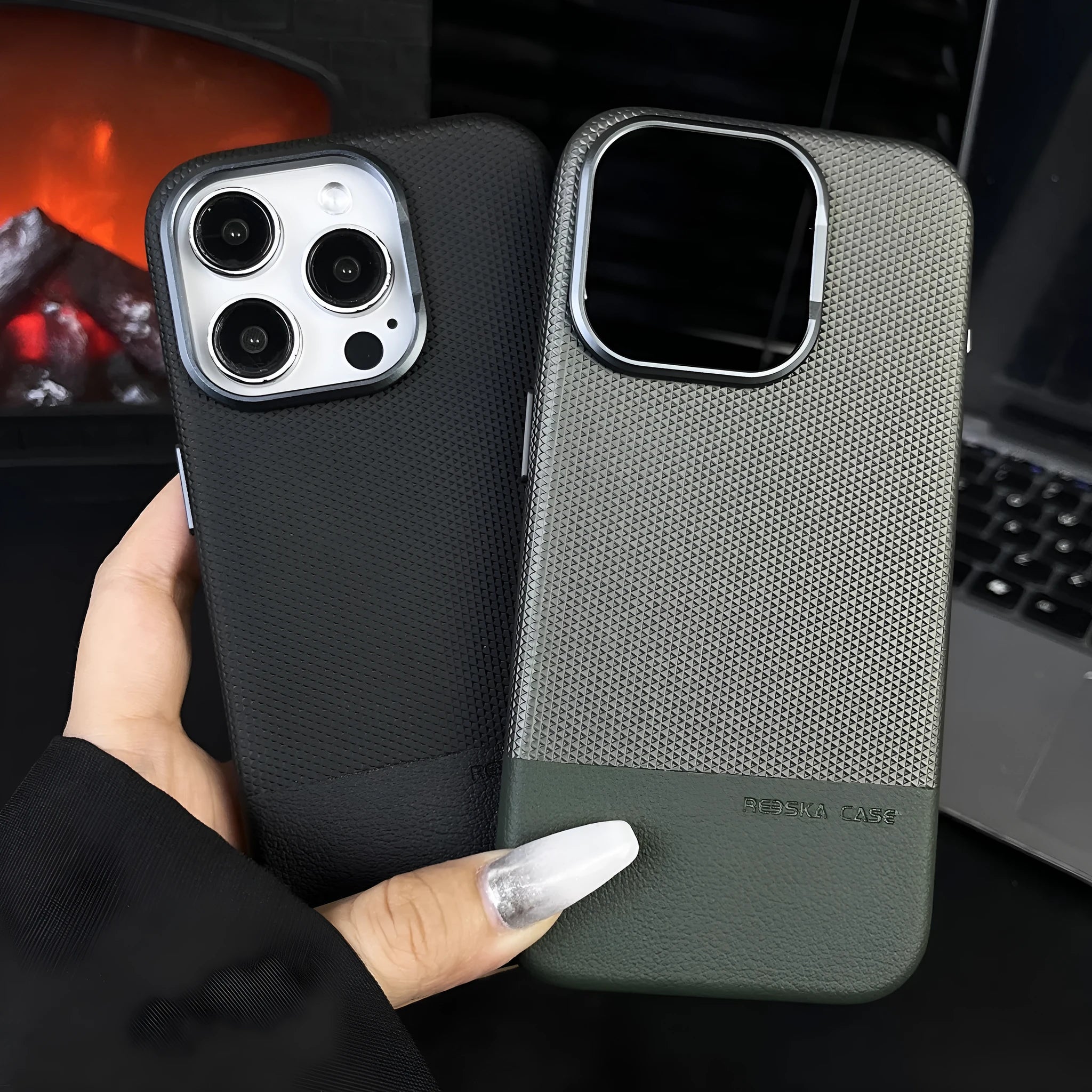 Black iPhone case with dragon scale texture and leather stitching, showing built-in magnetic ring on the back.