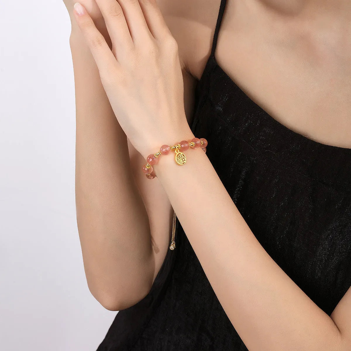 Women's Strawberry Quartz crystal bracelet with geometric design and Fu character, electroplated metallic finish