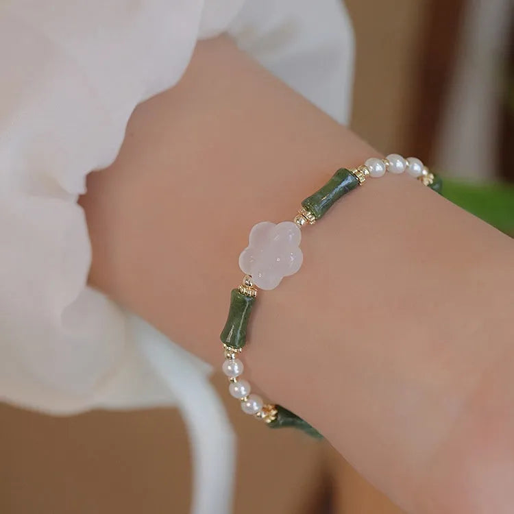 Chinese style olivine bamboo joint bracelet with Hetian jade and copper shell pearls on wrist