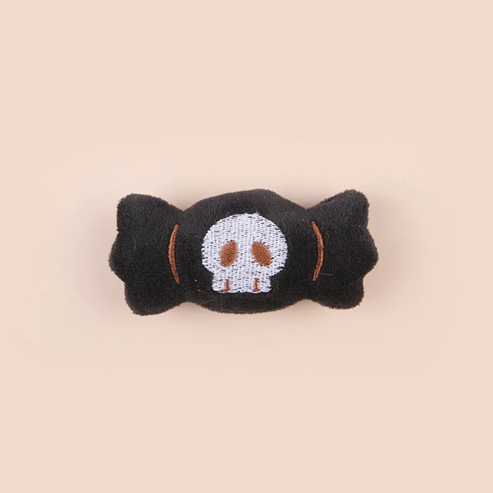 Plush cat teaser wand with candy-shaped attachment for interactive play