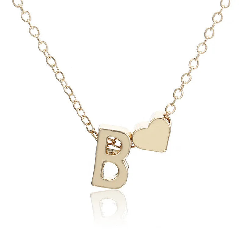 Peach heart shaped letter necklace pendant in gold or silver alloy.