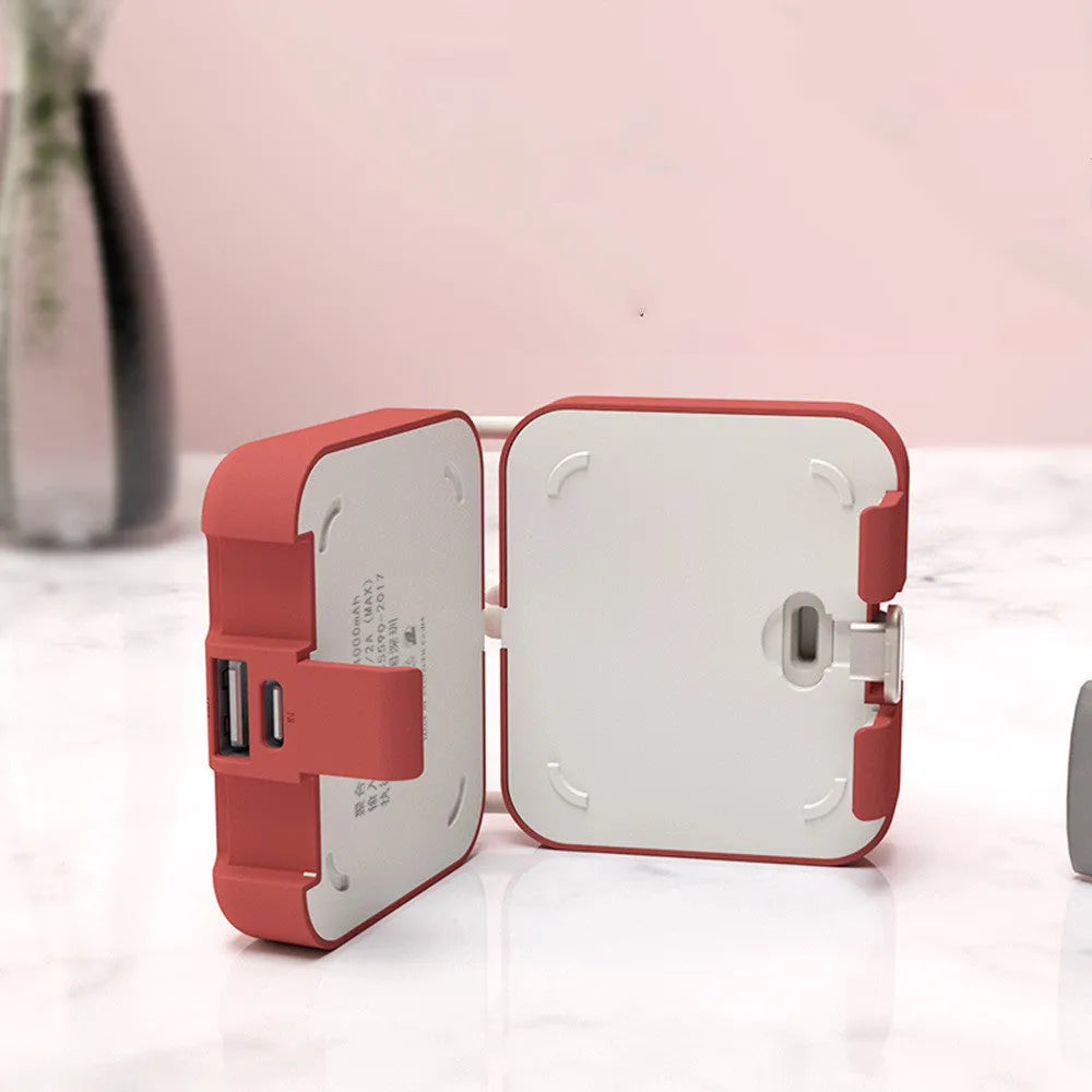 Handbag clip power bank in blue with mobile phone stand function showing charging ports