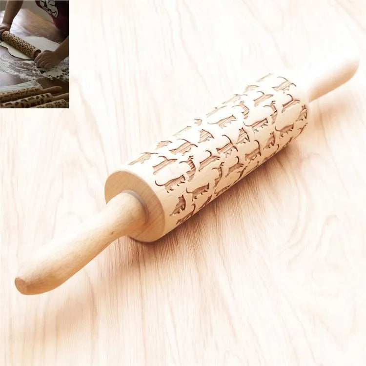 Wooden rolling pin with embossed Christmas patterns, 45cm long, on a kitchen worktop.
