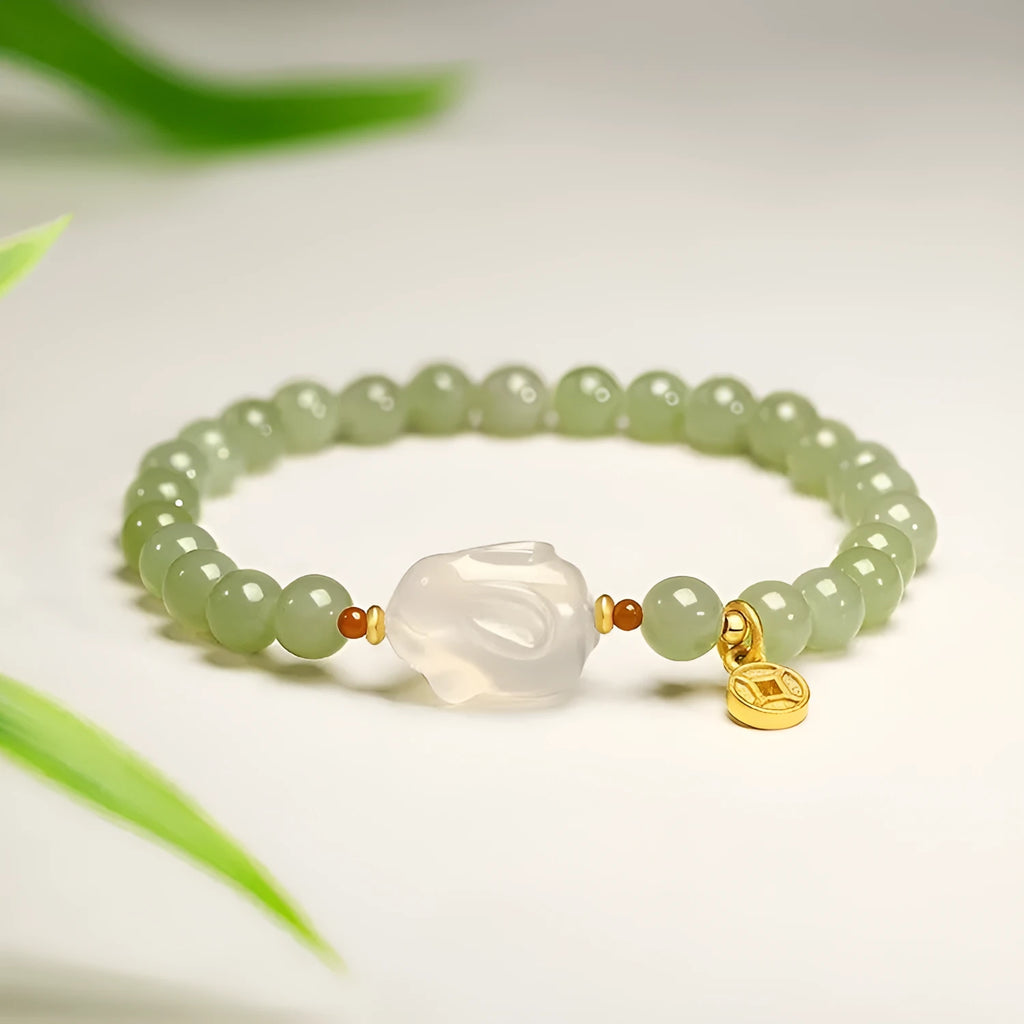 Handmade women's bracelet with a glass band and a choice of rabbit charm, presented in a gift box.