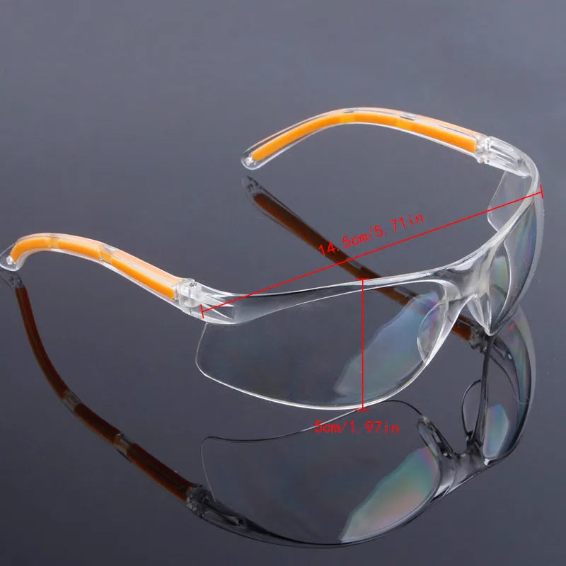 Transparent safety goggles with yellow frame made from impact-resistant polycarbonate