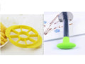 Stainless steel pineapple corer slicer with coloured ABS handle on kitchen counter