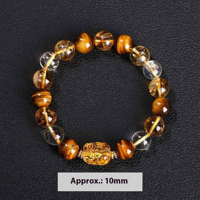 Close-up of a yellow tiger's eye and citrine gemstone bracelet with 10mm round beads and a steel clasp.
