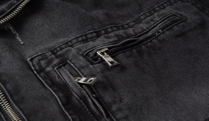 Black denim jacket with lapel collar, zip placket, long sleeves and zipper pockets, slim fit
