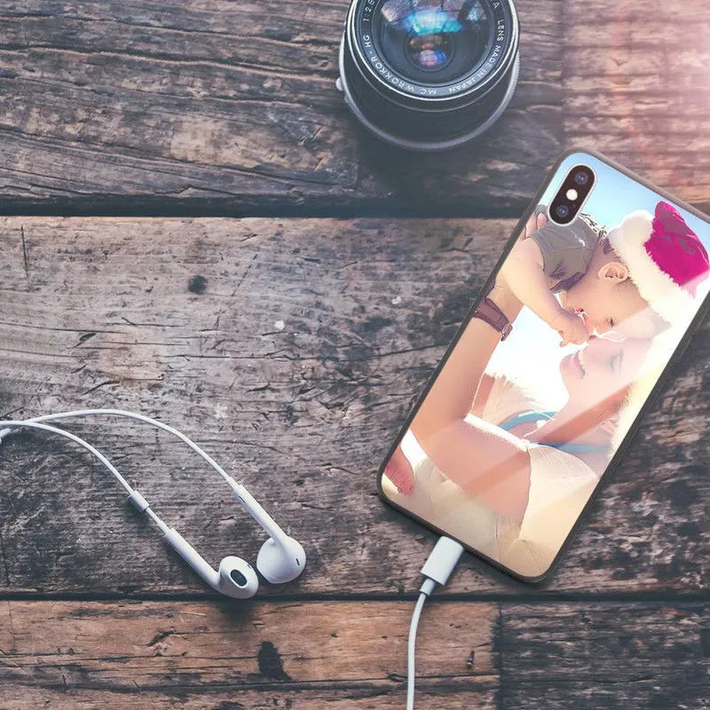 Patterned ultra-thin iPhone case with raised edges protecting the screen and camera lens.