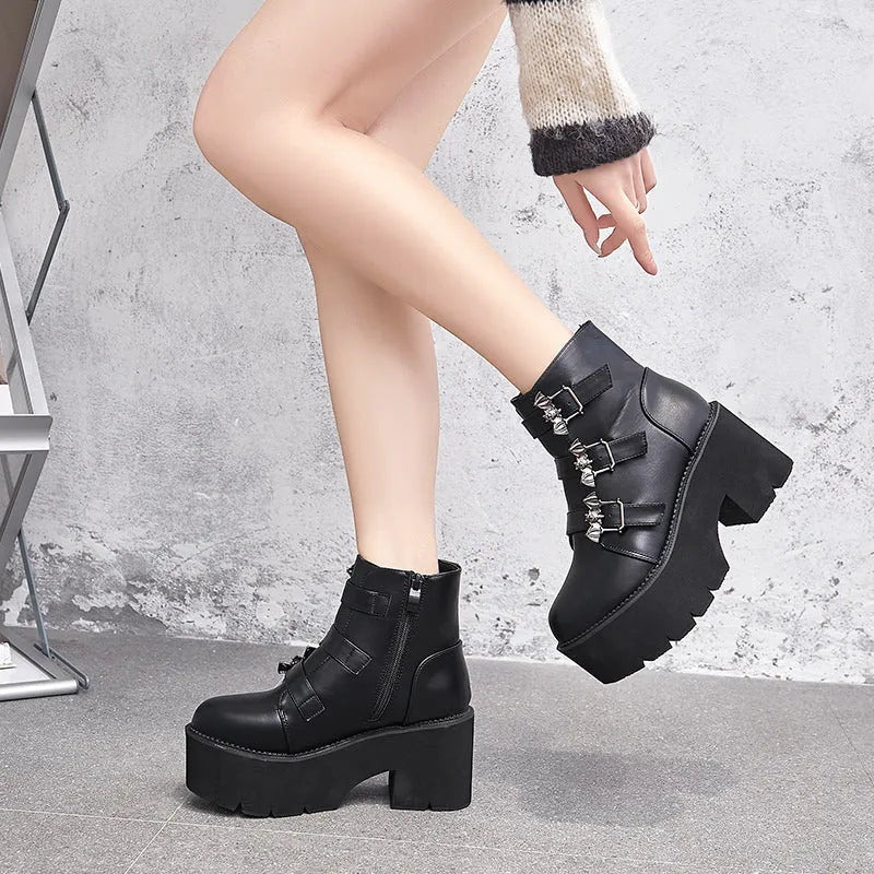 Black women's punk gothic ankle boots with bat buckle, side zip, and thick heel.