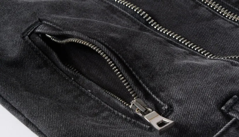 Black denim jacket with lapel collar, zip placket, long sleeves and zipper pockets, slim fit