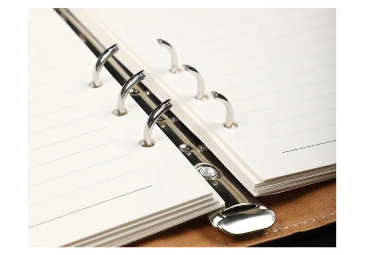 A5 leather notebook with 6-hole binder clip closure and hard cover