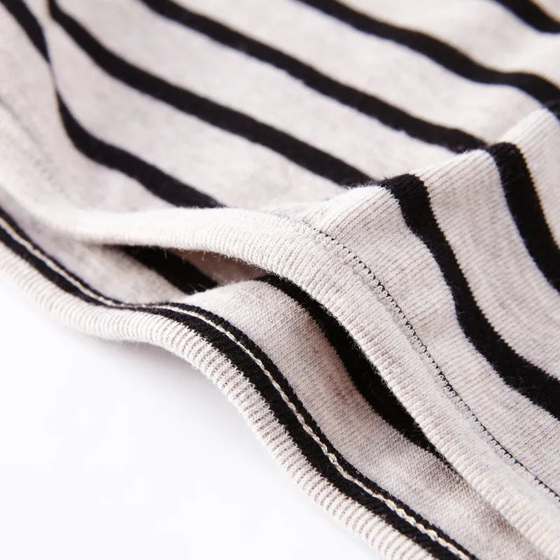 Red and white striped long sleeve cotton t-shirt for a baby girl on a hanger