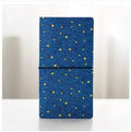 Japanese-style cartoon art notebook with hand-painted cover designs including cat, bird, and stars.
