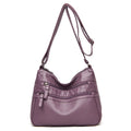 Real washed leather crossbody bag in solid colour with soft handle and slit pocket
