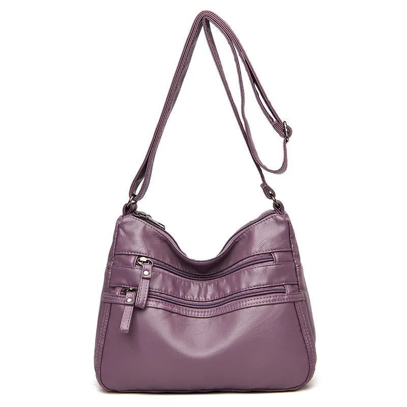 Real washed leather crossbody bag in solid colour with soft handle and slit pocket