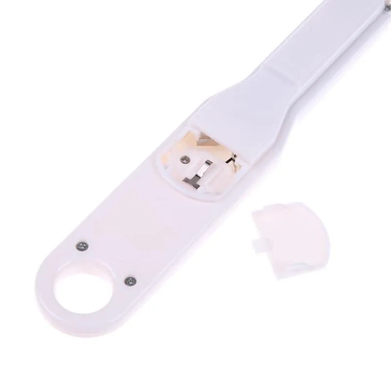 White digital spoon kitchen scale with LCD display showing weight measurement