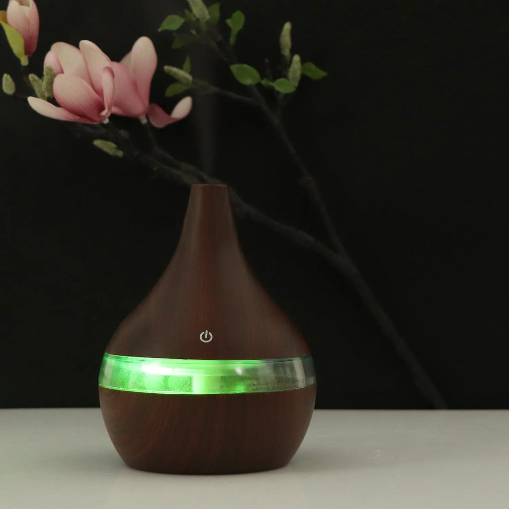 USB-powered mini humidifier in columnar design with wood grain finish and remote control