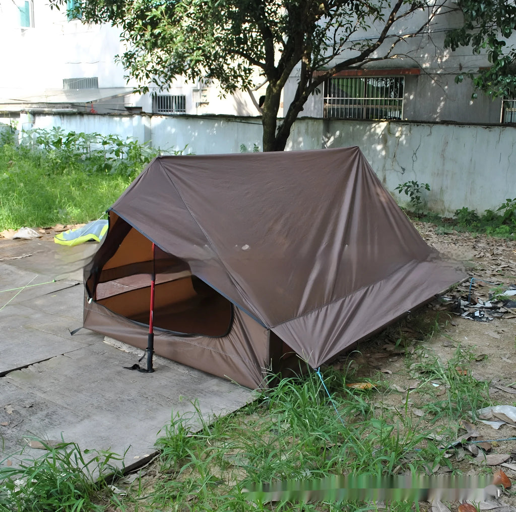 Brown or white A-line pole-free cabin tent for 2-3 people with hiking cane setup.