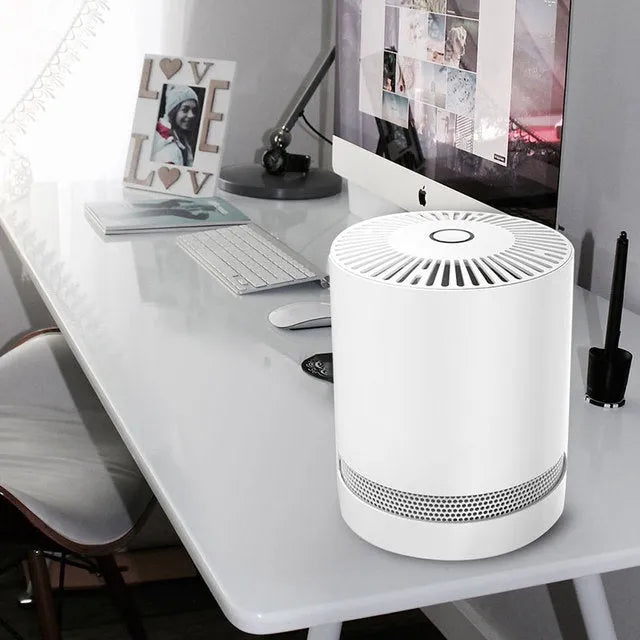 White compact desktop air purifier with front grille, dimensions 175x175x220mm, on a wooden desk