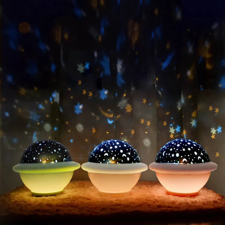 UFO-shaped plastic night light projecting starry sky pattern, available in green, pink, or white