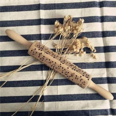 Personalized Christmas rolling pin with a variety of embossed holiday designs, including snowflakes, reindeer, and Merry Christmas patterns