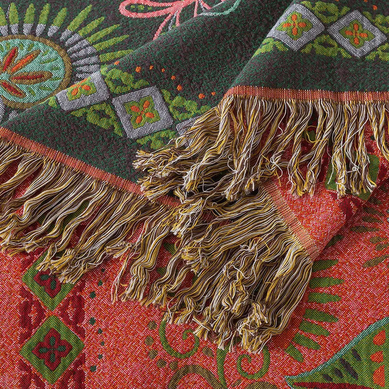 Cotton gauze towel quilt with tassels in beige flower pattern on a bed