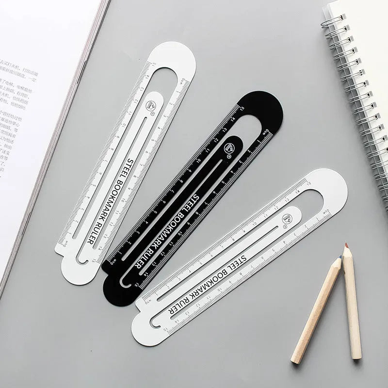 Black and white two-sided metal ruler showing 12 cm manganese steel construction