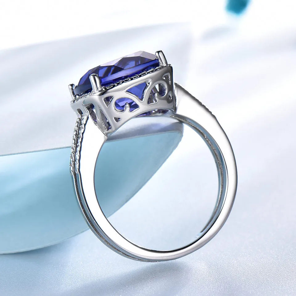Close-up of a women's sterling silver ring with a genuine blue tanzanite stone.