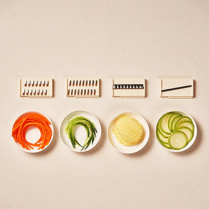 Versatile vegetable slicer and chopper with interchangeable blades and built-in storage container