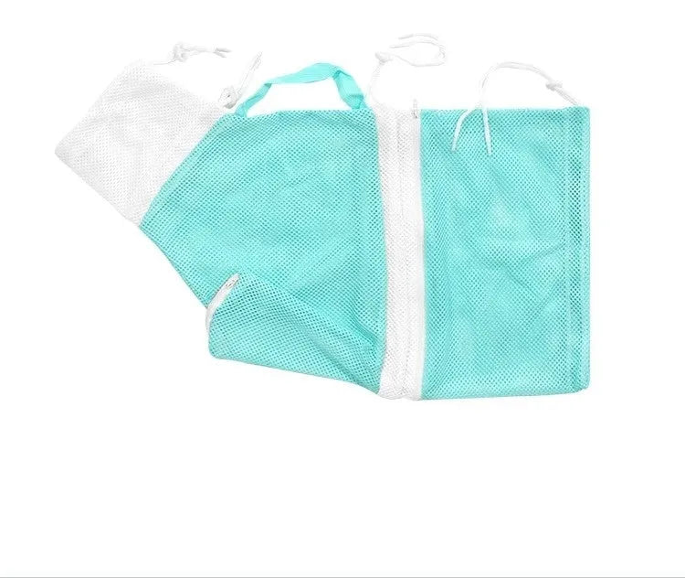 Pink and white detachable cat grooming bag with scratch-resistant fabric next to a miracle baby sponge.