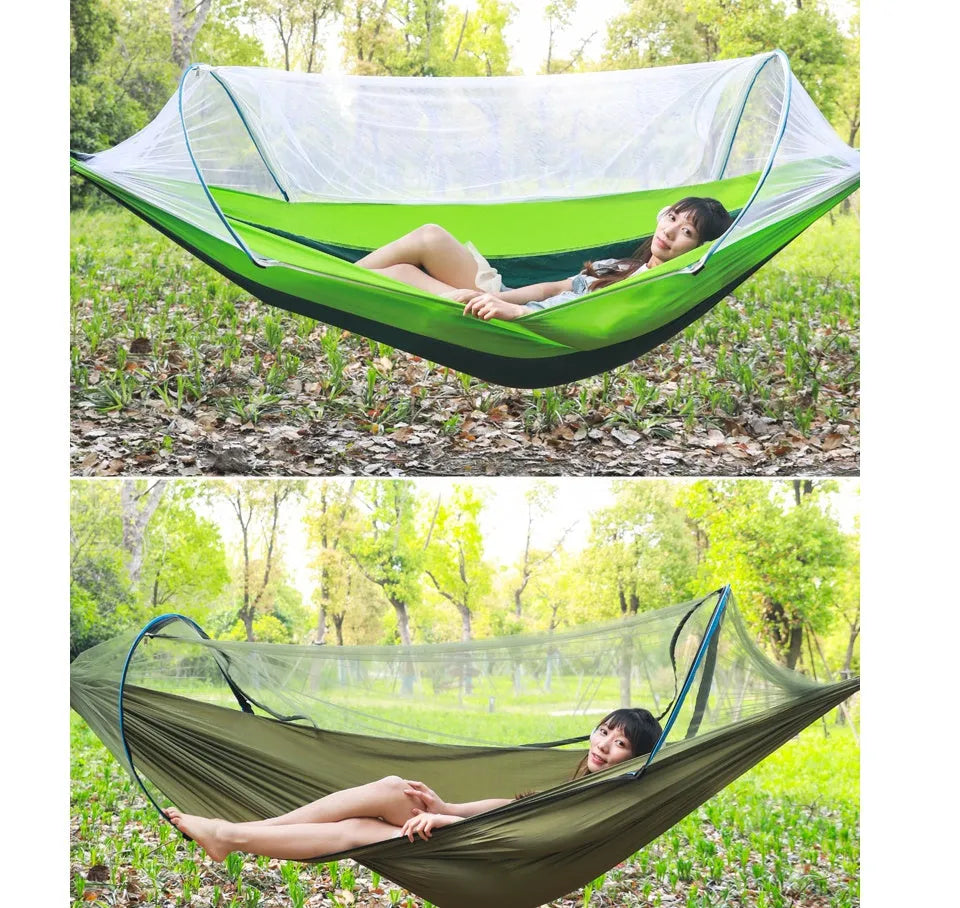 Double hammock bed 260x150cm in Army Green with mosquito-blocking mesh on a camping site