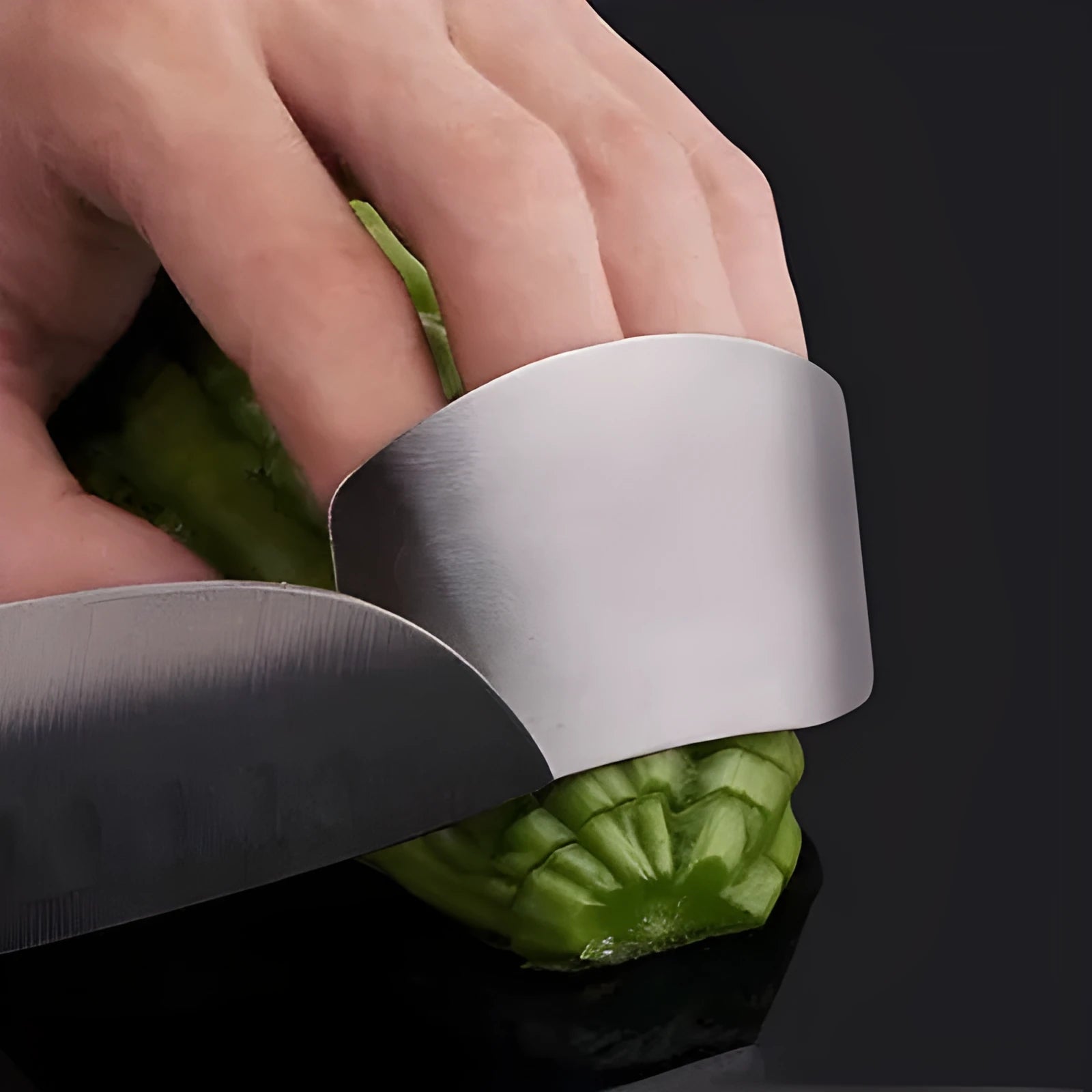 Stainless steel finger guard for cutting vegetables, shown in single and double finger sizes.