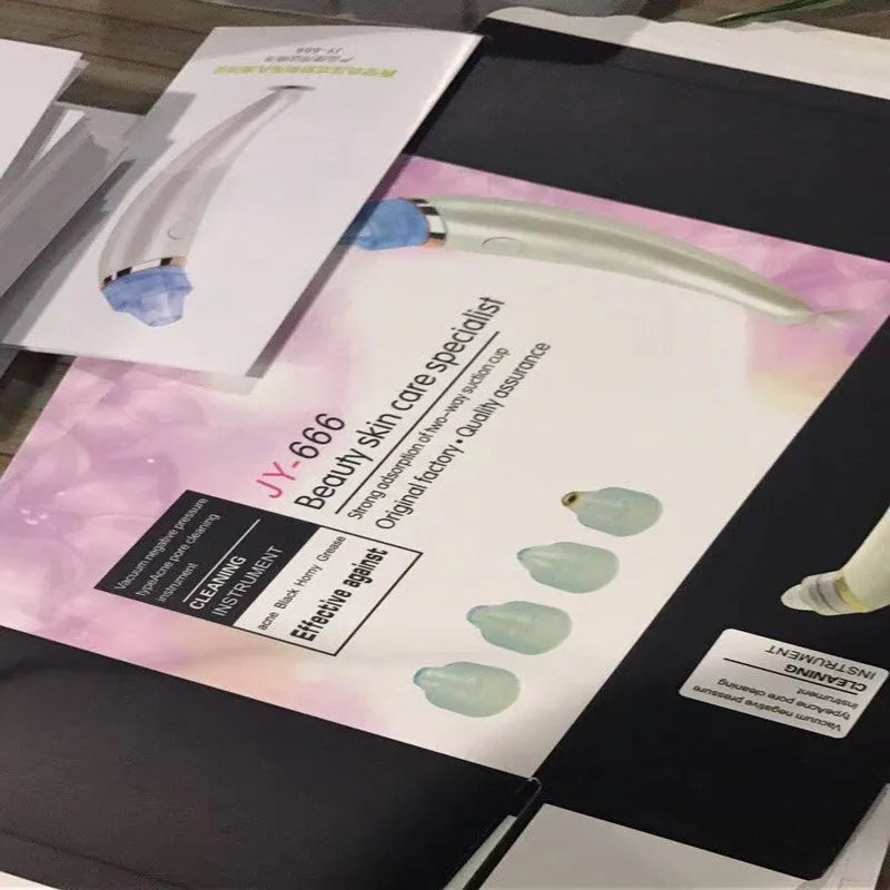 Rose gold and white electric blackhead suction instrument for facial pore cleaning.
