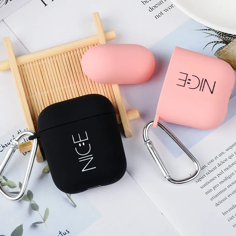 Black and pink AirPods case covers with flower, love heart, and smiley face designs