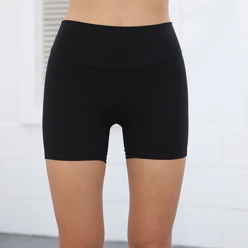 Women's high waist fitness shorts in quick dry nylon fabric with side pockets for summer sports