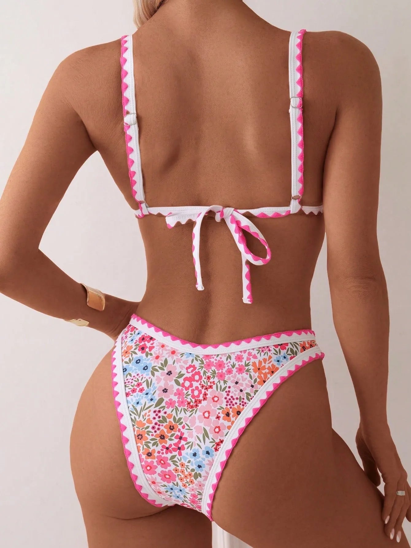 Women's printed swimming bikini with lace-up split bra and matching briefs in picture colour
