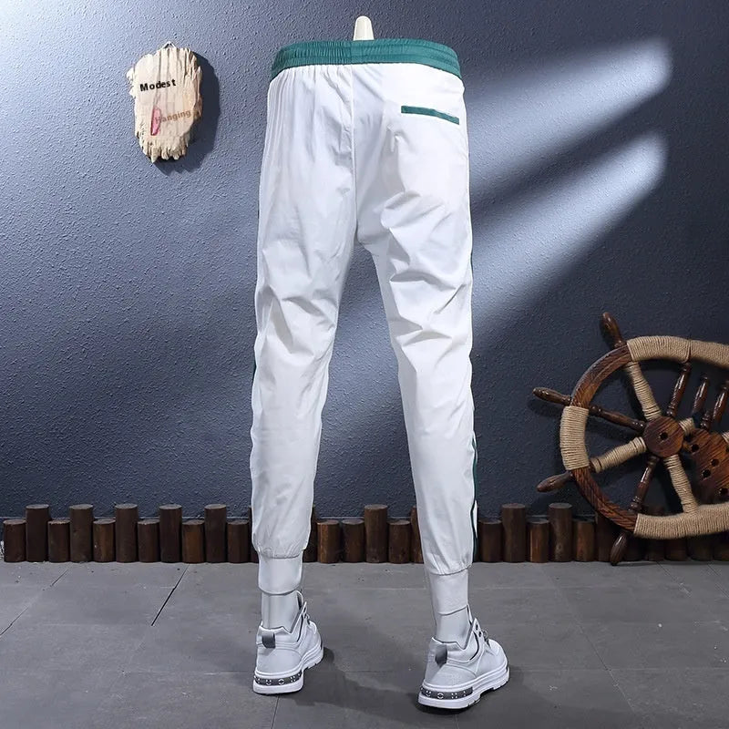 Ice silk breathable stretch ankle-tied skinny sports trousers for men in black striped pattern