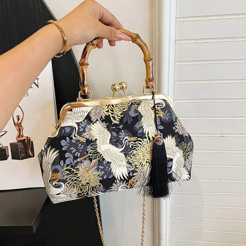Canvas shell shape crossbody bag with ethnic embroidery, 27cm x 17cm x 7cm, available in black