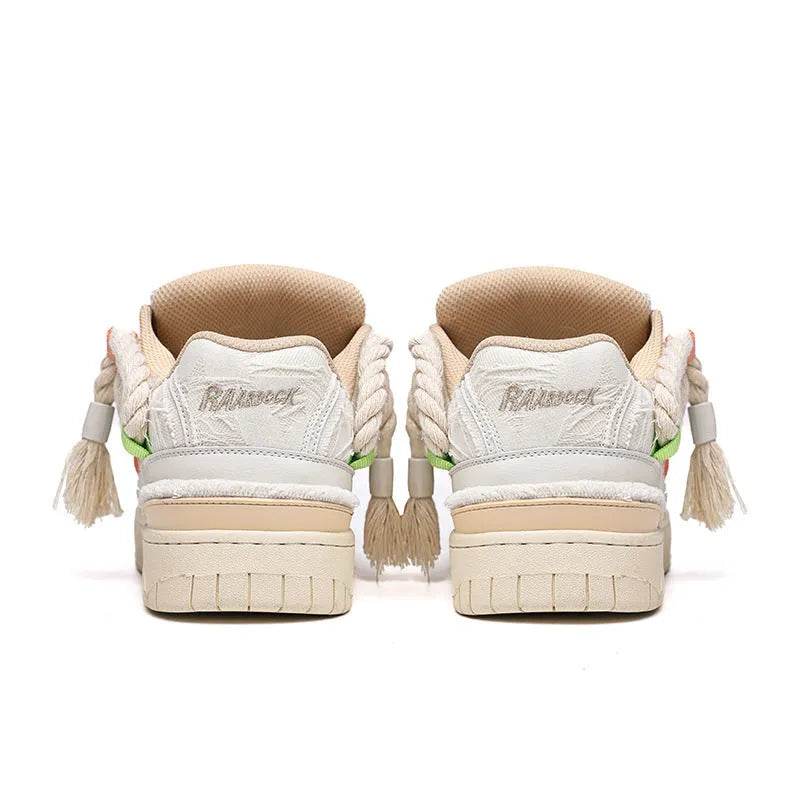 Creamy white low-top retro skateboard shoes with lace-up front and platform sole.