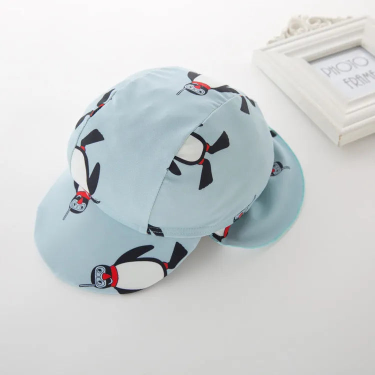 Boy's long sleeve penguin print swimsuit two-piece set with matching swimming cap