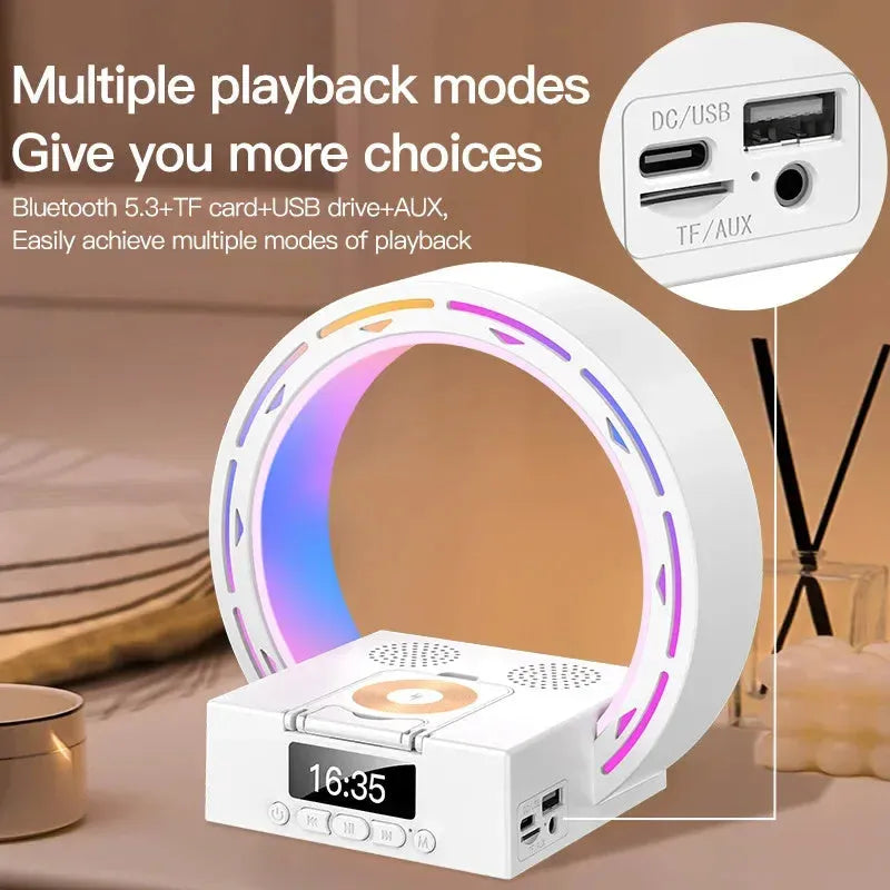 White multifunctional Bluetooth speaker with wireless charging pad, bedside lamp and digital clock display on wooden table