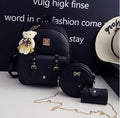 Three-piece PU leather backpack set for teenage girls showing backpack, shoulder bag and card holder