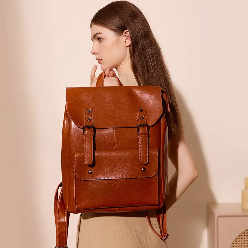Genuine cowhide leather women's computer backpack in black, brown, or coffee colour.