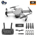 Grey foldable 4K dual camera aerial drone with remote controller and accessories