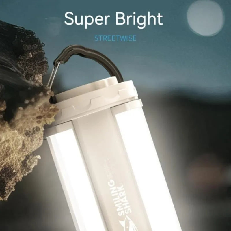 Camping lamp with magnetic charging port showing blue LED indicators and compact 62mm square design